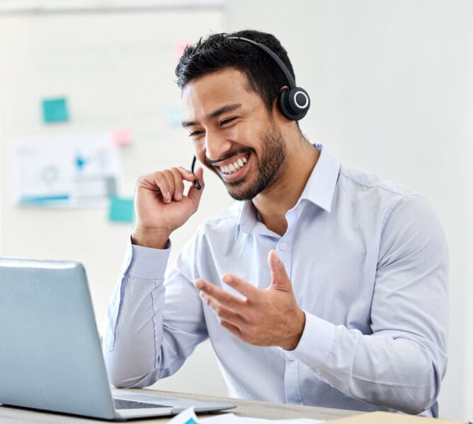 Asian man, laptop or call center worker in communication, customer service or contact us support office. Smile, happy and excited crm consultant or telemarketing receptionist on tech sales consulting