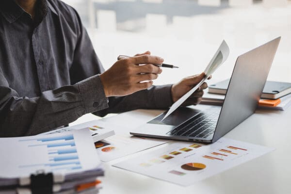 Businessman working with business report papers on office desk