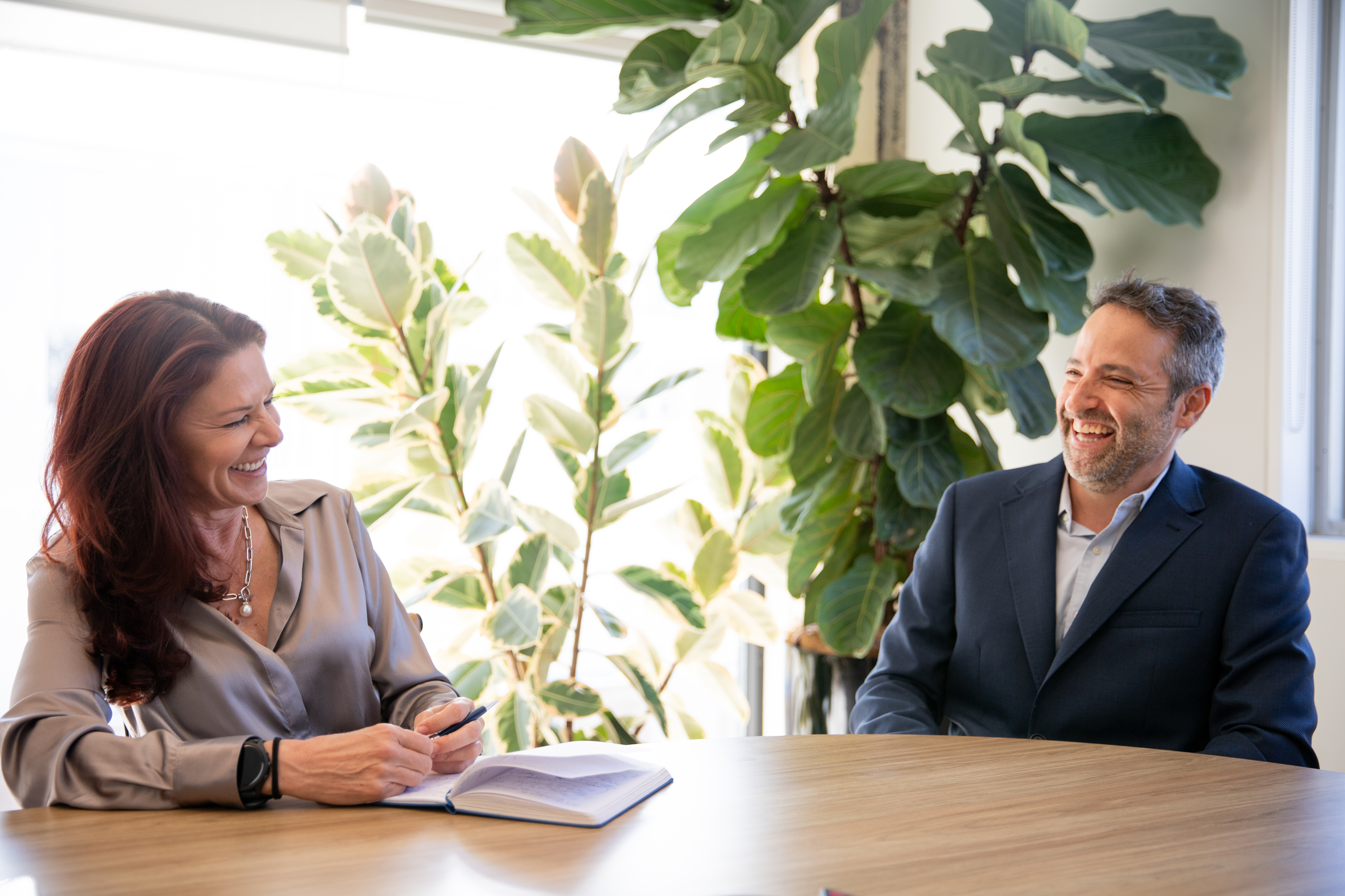 Tiffany Besnard and Shaun Kraitzick in conversation during a meeting at the 26 Degrees Global Markets office.